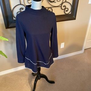 Elegant long sleeve top with mock neck.